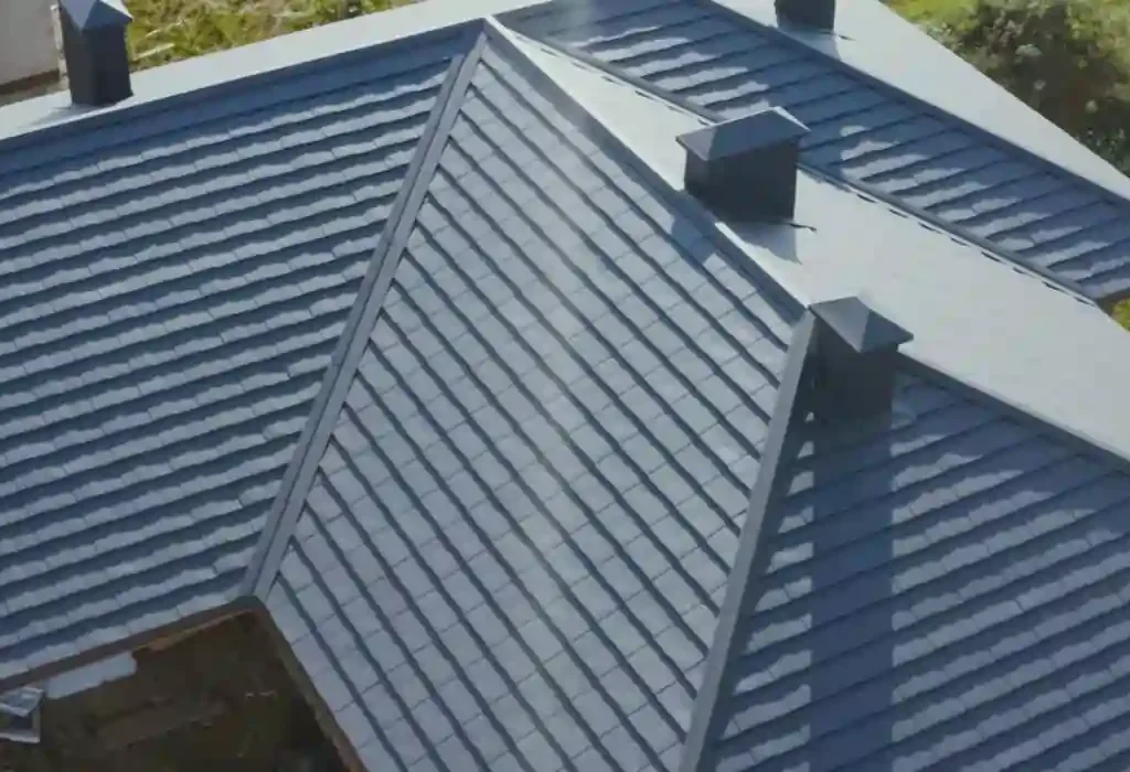 Roof restoration experts in Adelaide cleaning and recoating a terracotta roof.